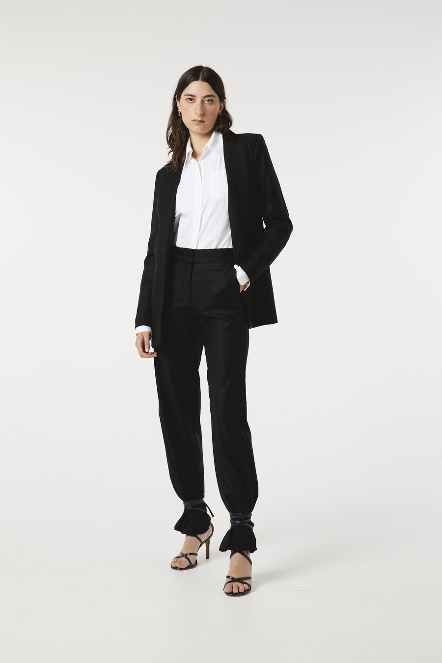 Model posing hand in pocket with ARNSDORF - SUIT TROUSER - BLACK