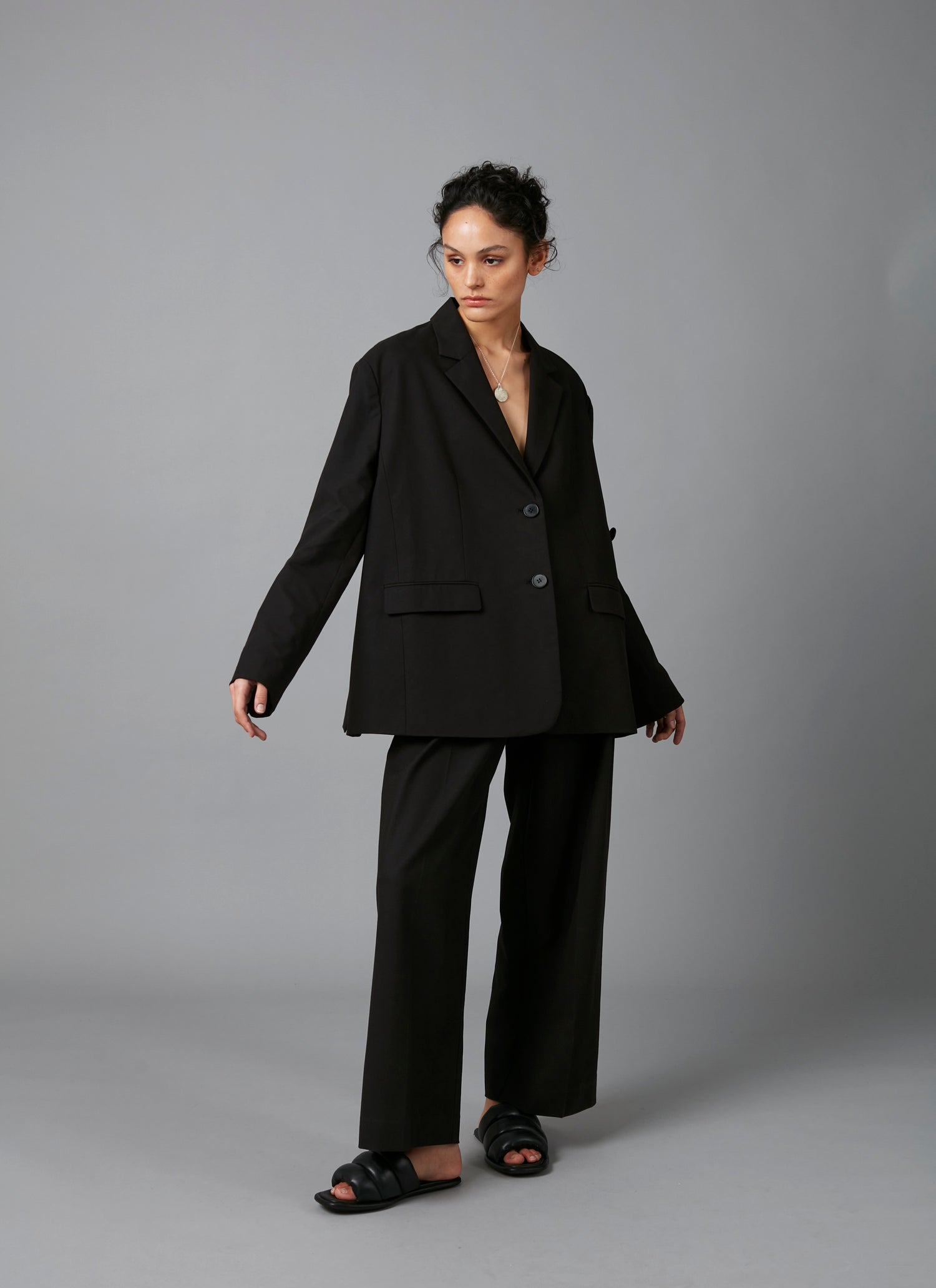 Model showing - Black Lita Oversized Cotton Tencel Tailored Jacket  and Black Sculpture Cotton Tencel Pants